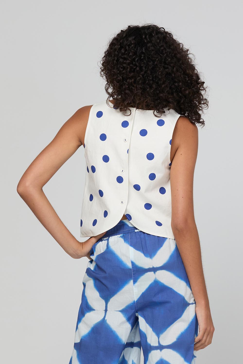 Model Genericm wearing size sample of the Rose Top – Polkadot in colour Polkadot, from the back