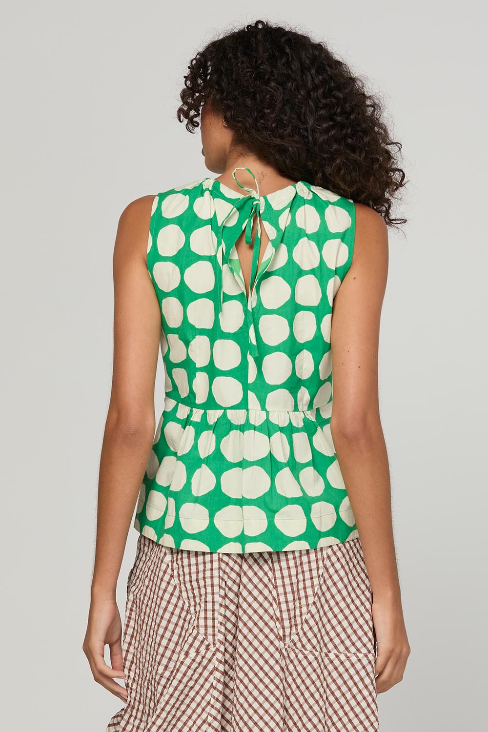 Model Genericm wearing size sample of the Carmen Top – Circulo in colour Circulo, from the back