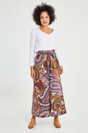 Model Olivia wearing size 10 of the Quincy Pant in colour Juniper (Green), from the front, showing the whole outfit