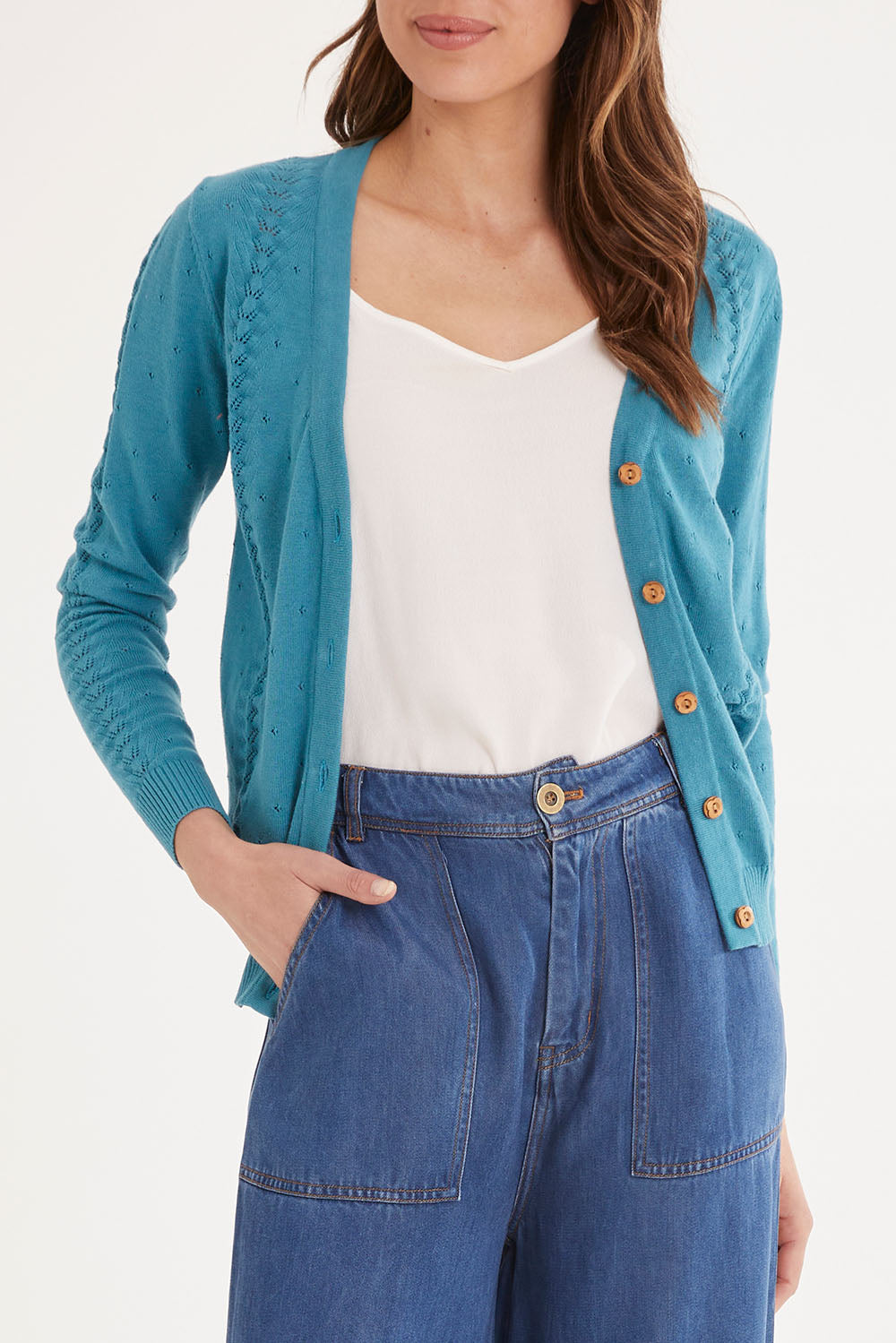 Model Madeline wearing size S of the Lora Cardigan in colour Blue (Blue), from the front, cropped image