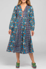 A model wearing the Lettie Cotton Dress in colour Lettie (Blue), from the front, cropped image