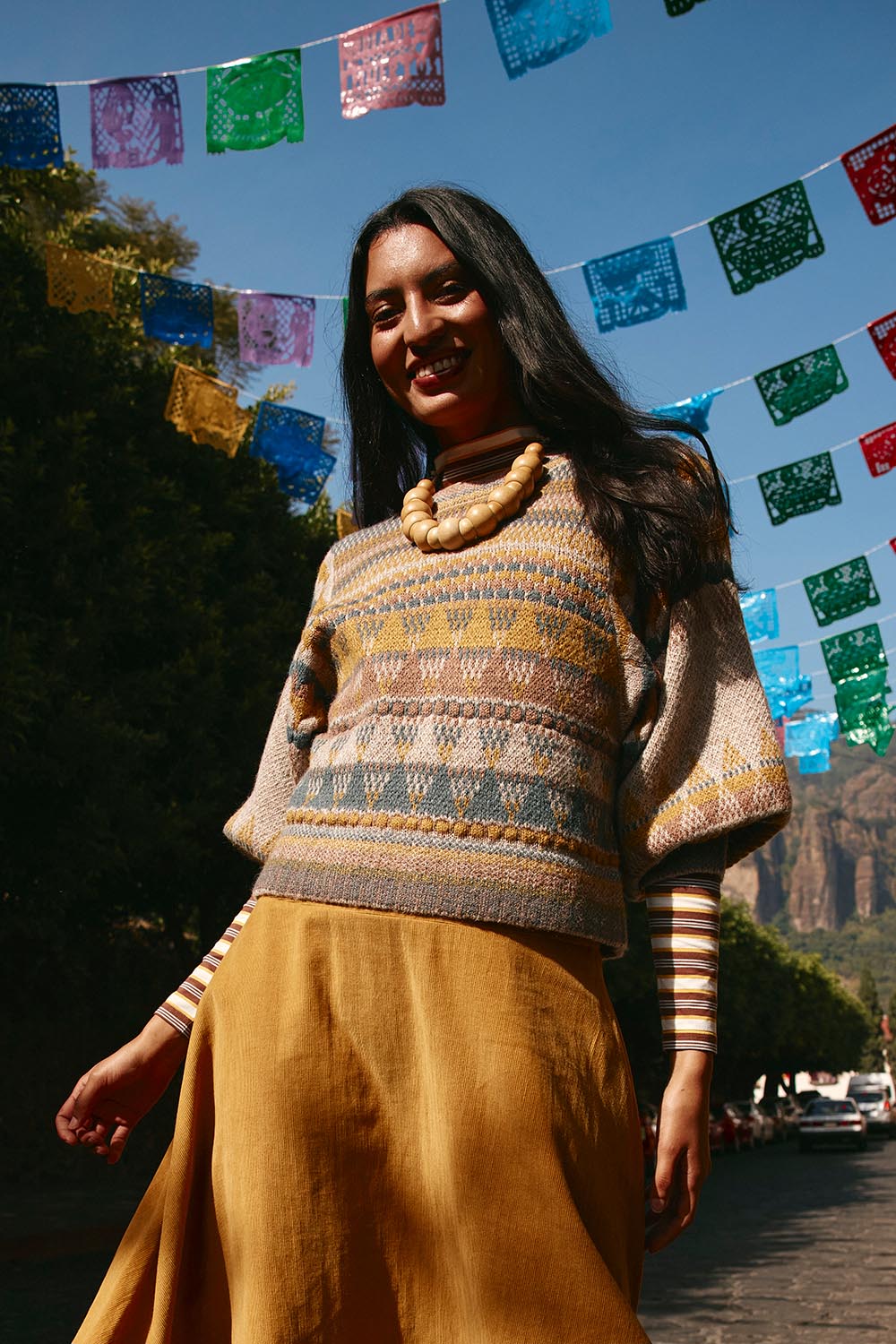 A model wearing the Sofia Wool Blend Jumper in colour Oatmeal, from the front, showing the whole outfit