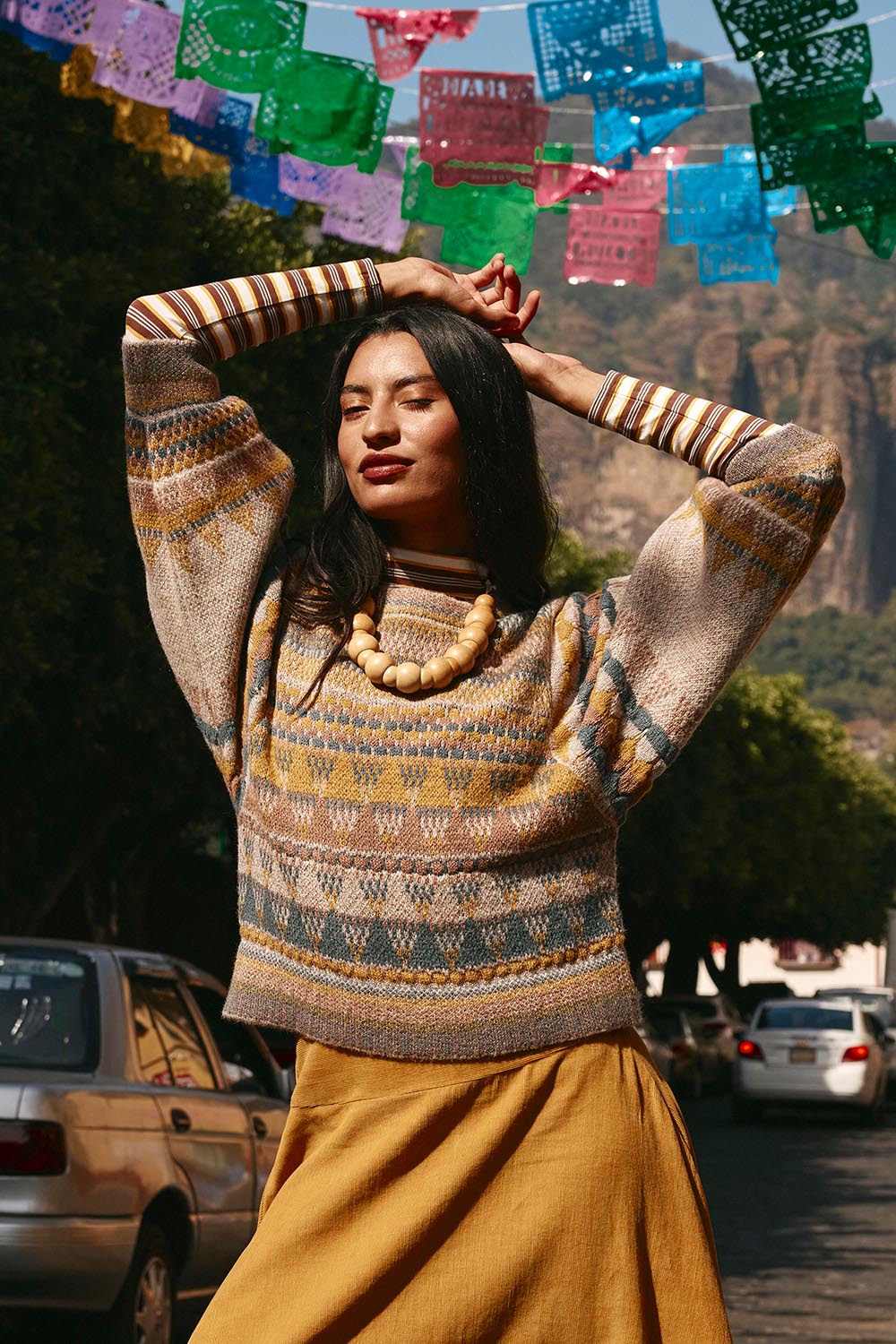 A model wearing the Sofia Wool Blend Jumper in colour Oatmeal, from the front, showing the whole outfit