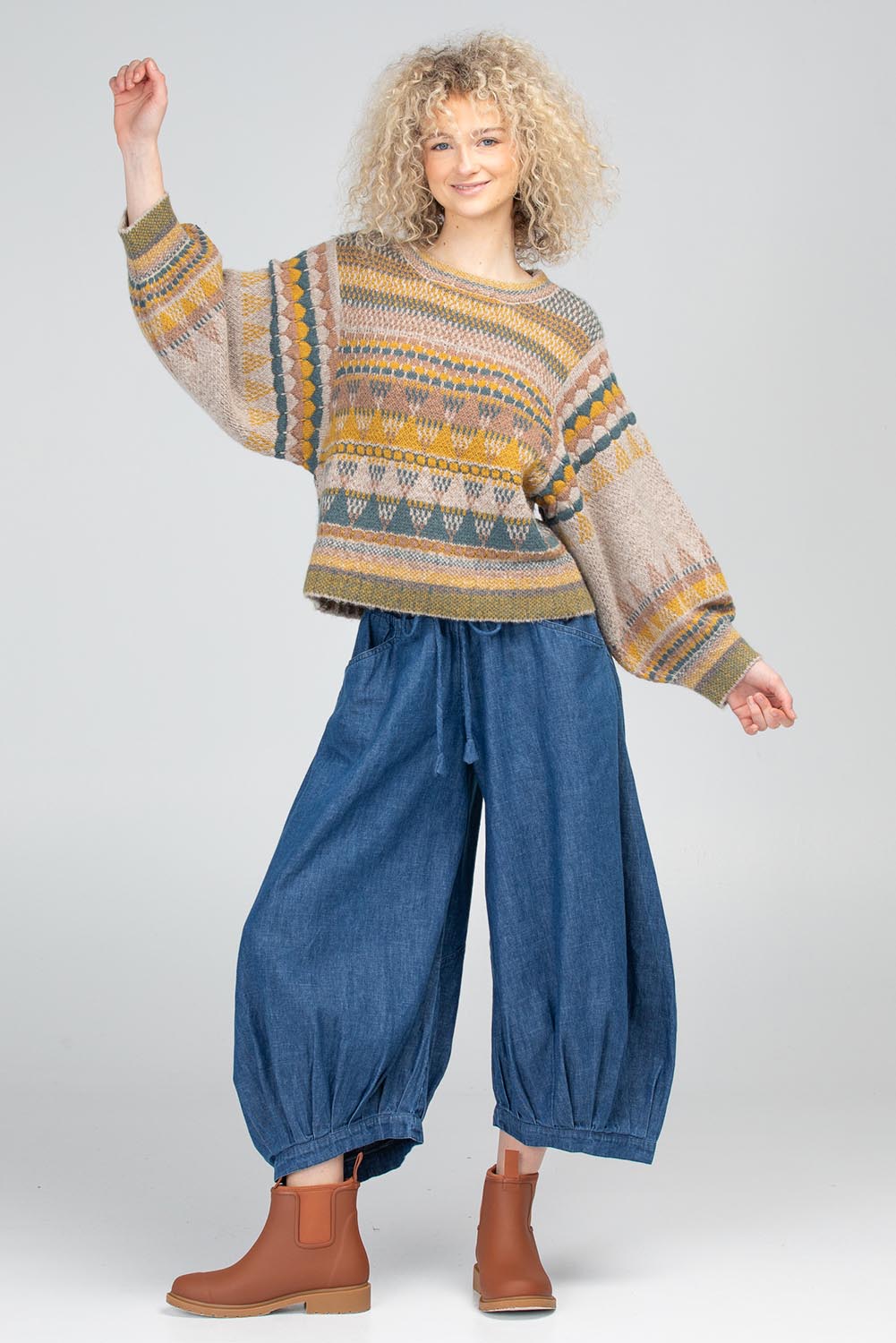 A model wearing the Sofia Wool Blend Jumper in colour Oatmeal, from the front, showing the whole outfit