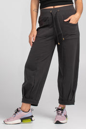 A model wearing the Guru Cotton Blend Track in colour Black (Black), from the front, cropped image