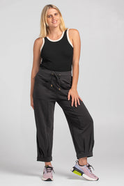 A model wearing the Guru Cotton Blend Track in colour Black (Black), from the front, showing the whole outfit