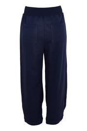 Product shot of the Guru Cotton Blend Track in colour Navy (Blue), from the back