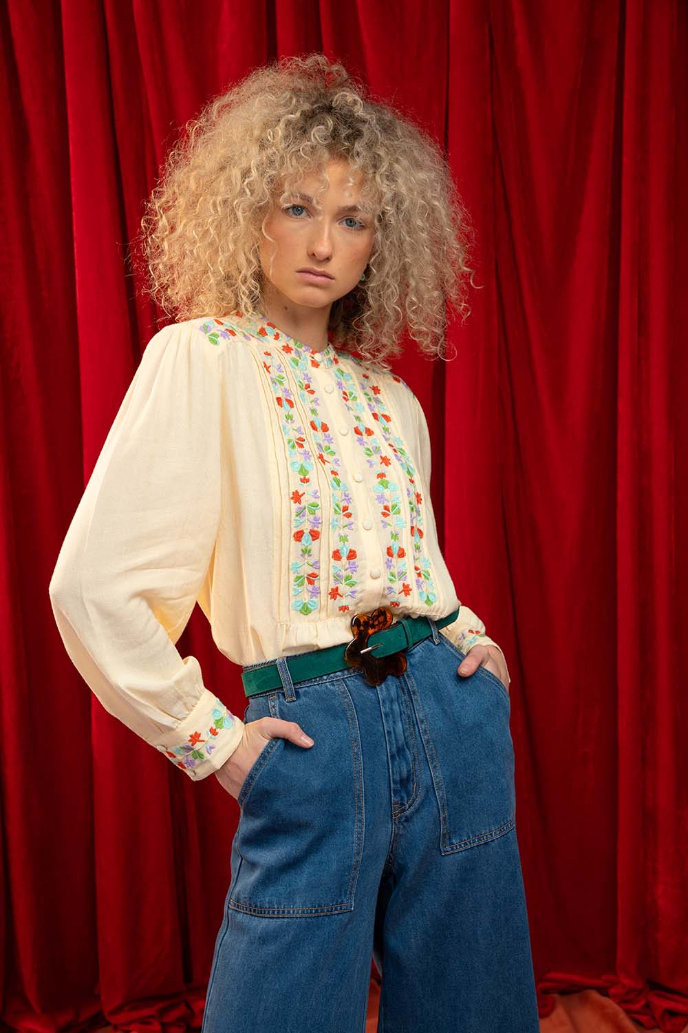 A model wearing the Rosemary Cotton Linen Top in colour Cream, from the front, showing the whole outfit