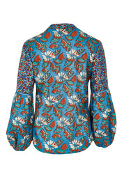 Product shot of the Mittie Cotton Top in colour Lettie (Blue), from the back