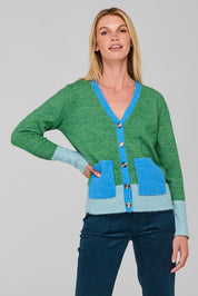 A model wearing the Poet Cardigan in colour Green (Green), from the front, cropped image