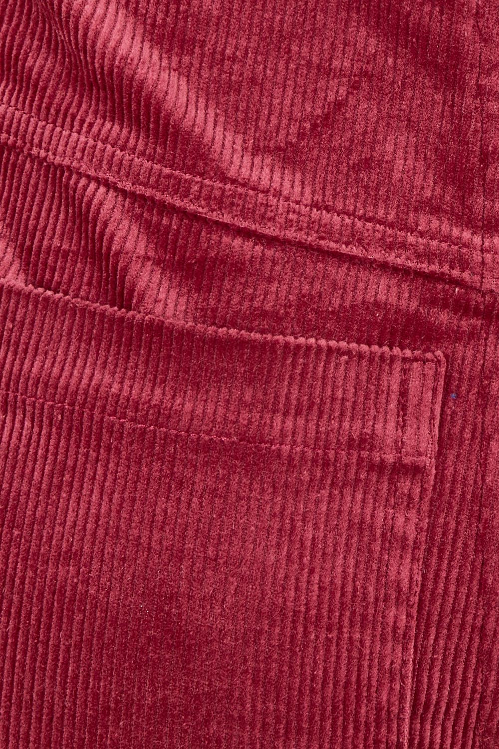Product shot of the Dharma Pant in colour Cranberry (Red), detail