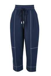 Product shot of the Jonte Pant in colour Navy (Blue), from the front
