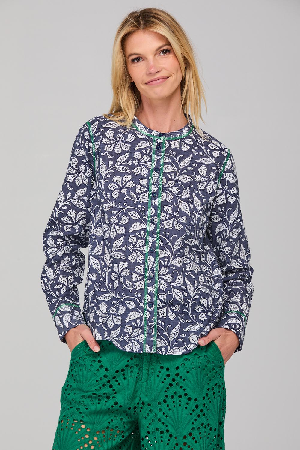 A model wearing the Clove Shirt in colour Izuminavy (Blue), from the front, cropped image