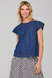 A model wearing the Leaf Top in colour Darkdenim (Blue), from the front, cropped image