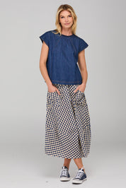 A model wearing the Leaf Top in colour Darkdenim (Blue), from the front, showing the whole outfit