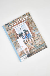A model wearing size OneSize of the Graziher in colour JuneJuly23 (Black), from the front, showing the whole outfit