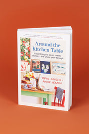 A model wearing size OneSize of the Around The Kitchen Table in colour Kitchen (White), from the front, showing the whole outfit