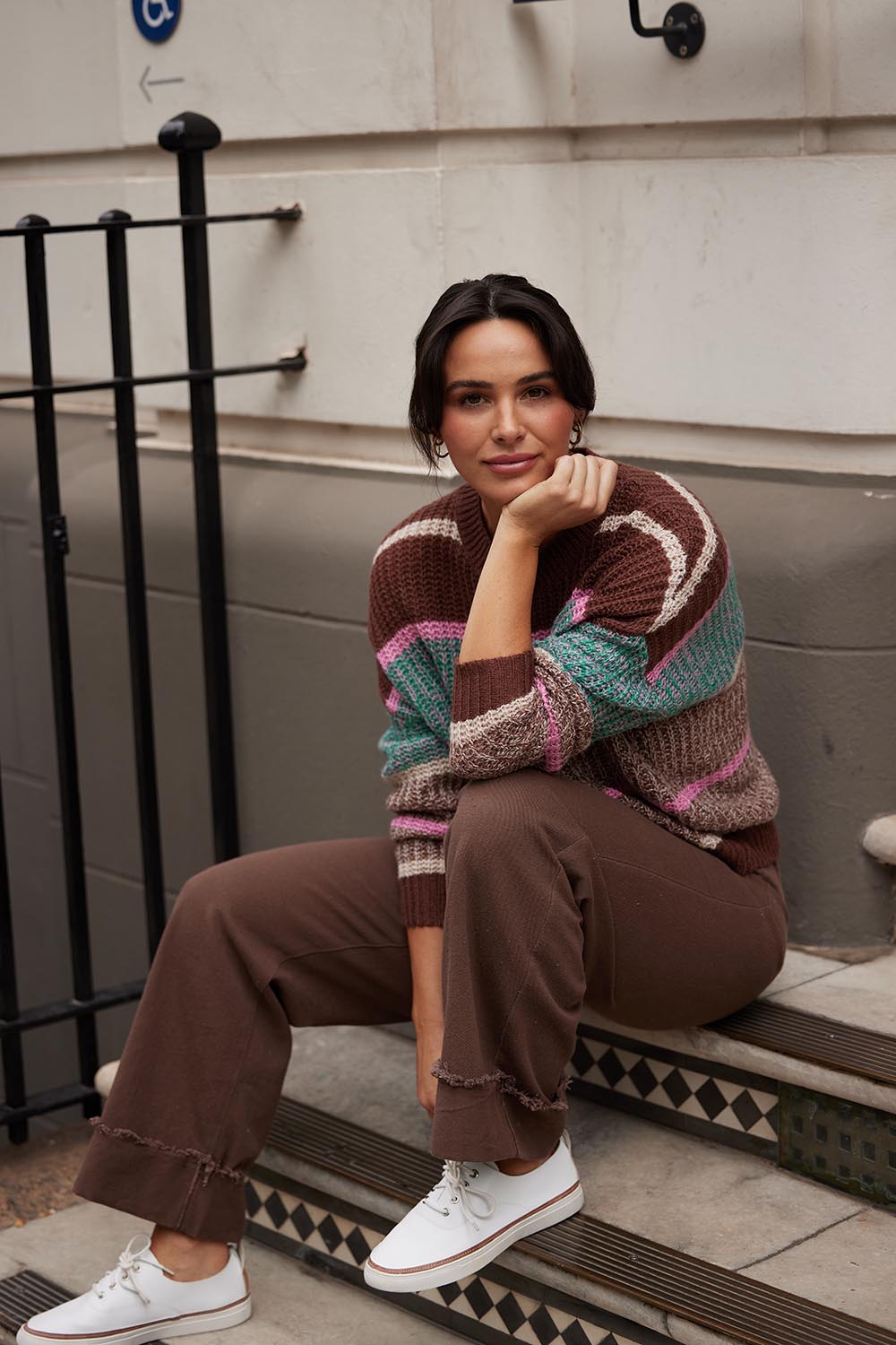 A model wearing the Leroy Pant in colour Chocolate, from the front, showing the whole outfit