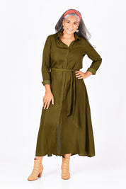 Model Nadine wearing size S of the Safari Dress in colour Moss (Green), from the front, showing the whole outfit