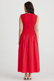 A model wearing the Daphne Cotton Blend Dress in colour Chilli (Red), from the back