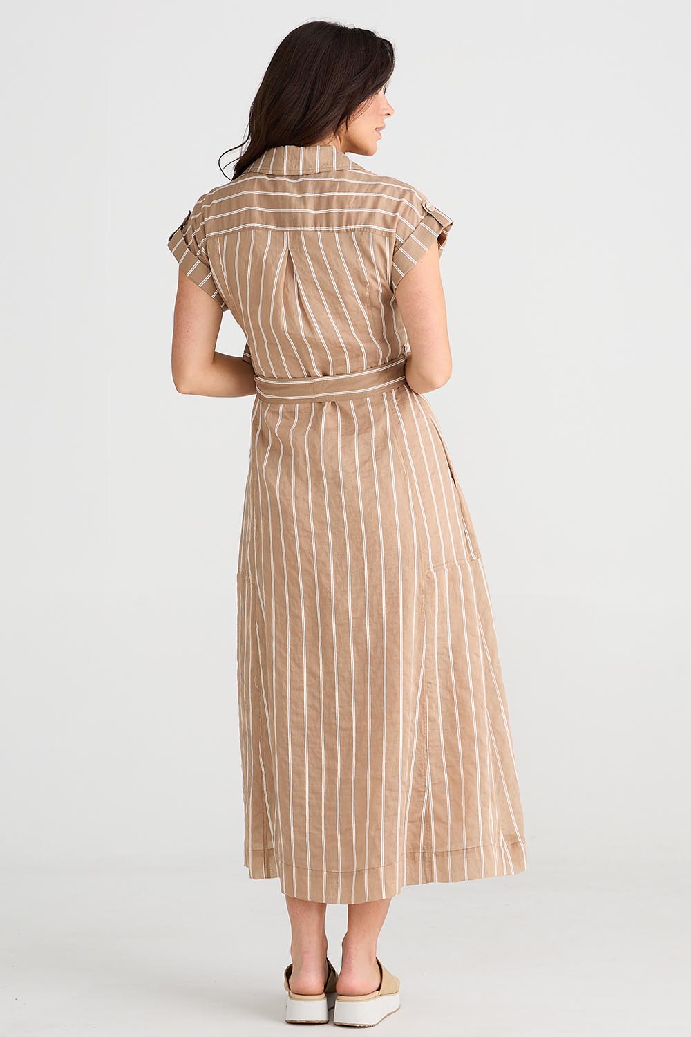 A model wearing the Portia Dress in colour Lattestrip, from the back