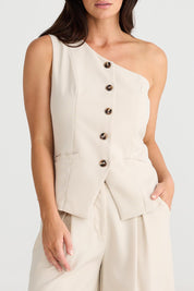 A model wearing the Rozalia Asymmetric Top in colour Oyster, from the front, cropped image