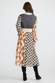 A model wearing the Lucy Dress in colour Vienna, from the back