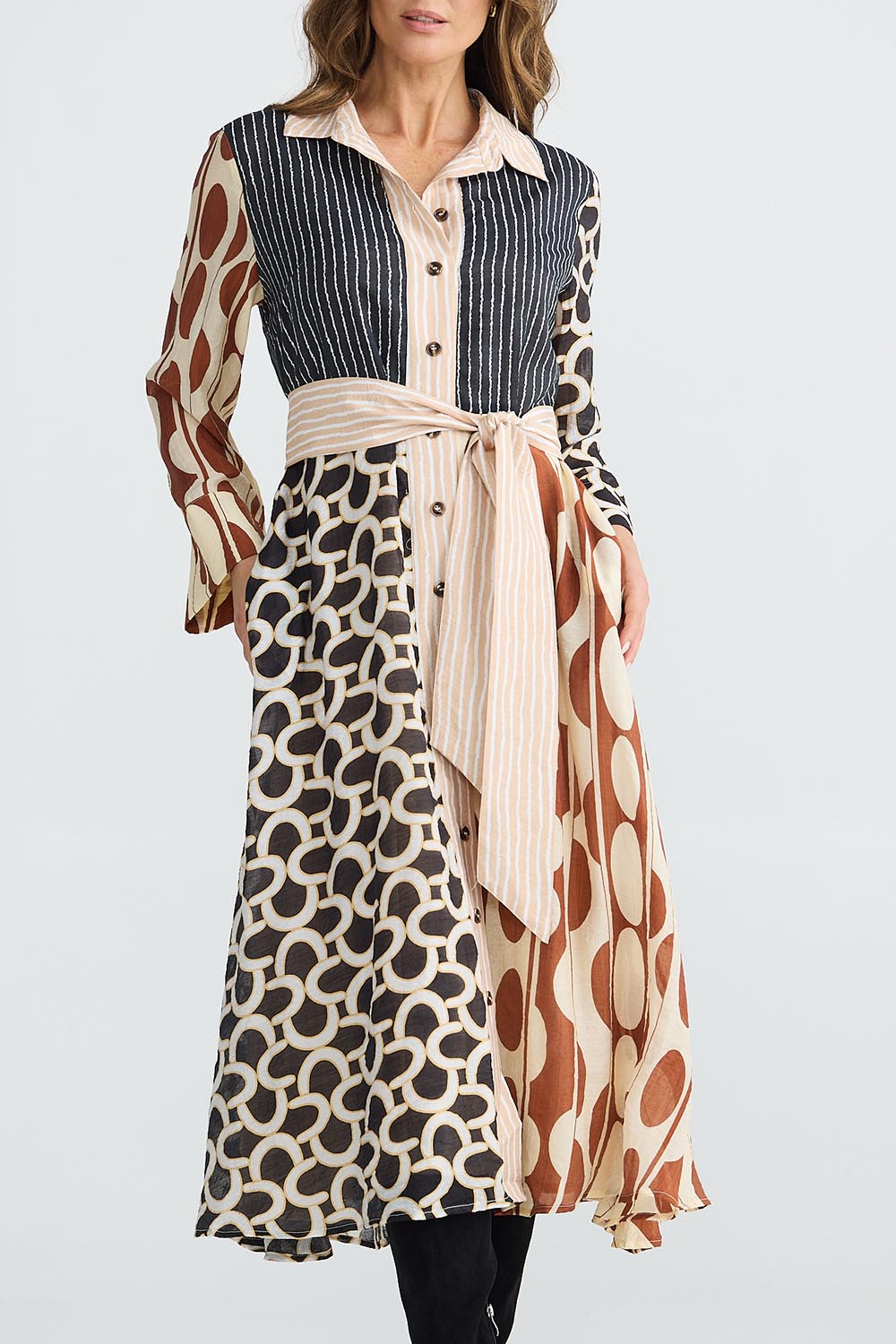 A model wearing the Lucy Dress in colour Vienna, from the front, cropped image