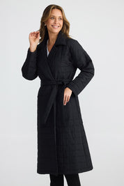 A model wearing the Bedford Longline Puffer in colour Black (Black), from the front, cropped image