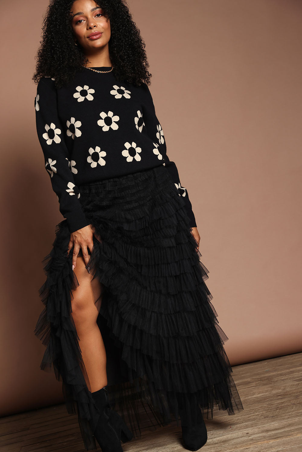 Model Ziara wearing size S of the Chance Skirt in colour Black (Black), from the front, showing the whole outfit