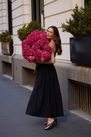 A model wearing the Avalon Cotton Linen Maxi Dress in colour Black (Black), from the front, showing the whole outfit