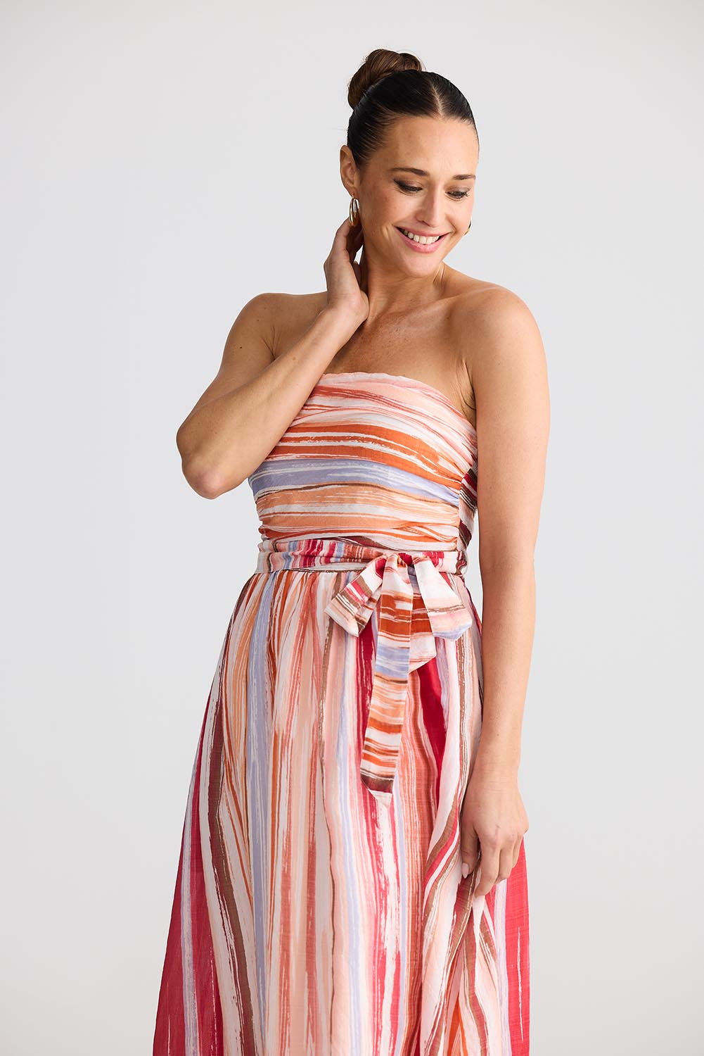 A model wearing the Avalon Dress in colour Painterly, from the front, cropped image