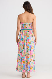A model wearing the Avalon Dress in colour Electricbl, from the back