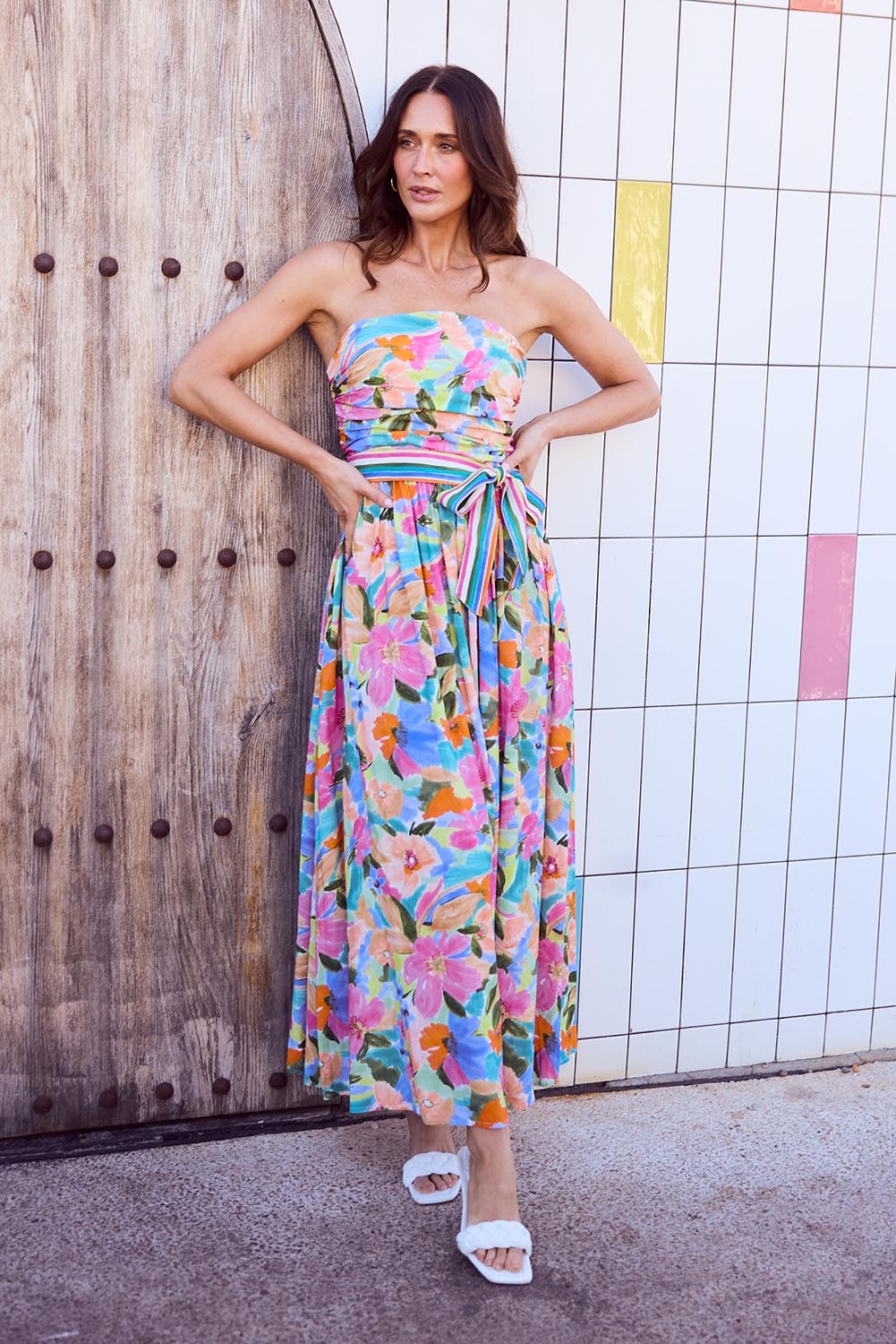 A model wearing the Avalon Dress in colour Electricbl, from the front, showing the whole outfit