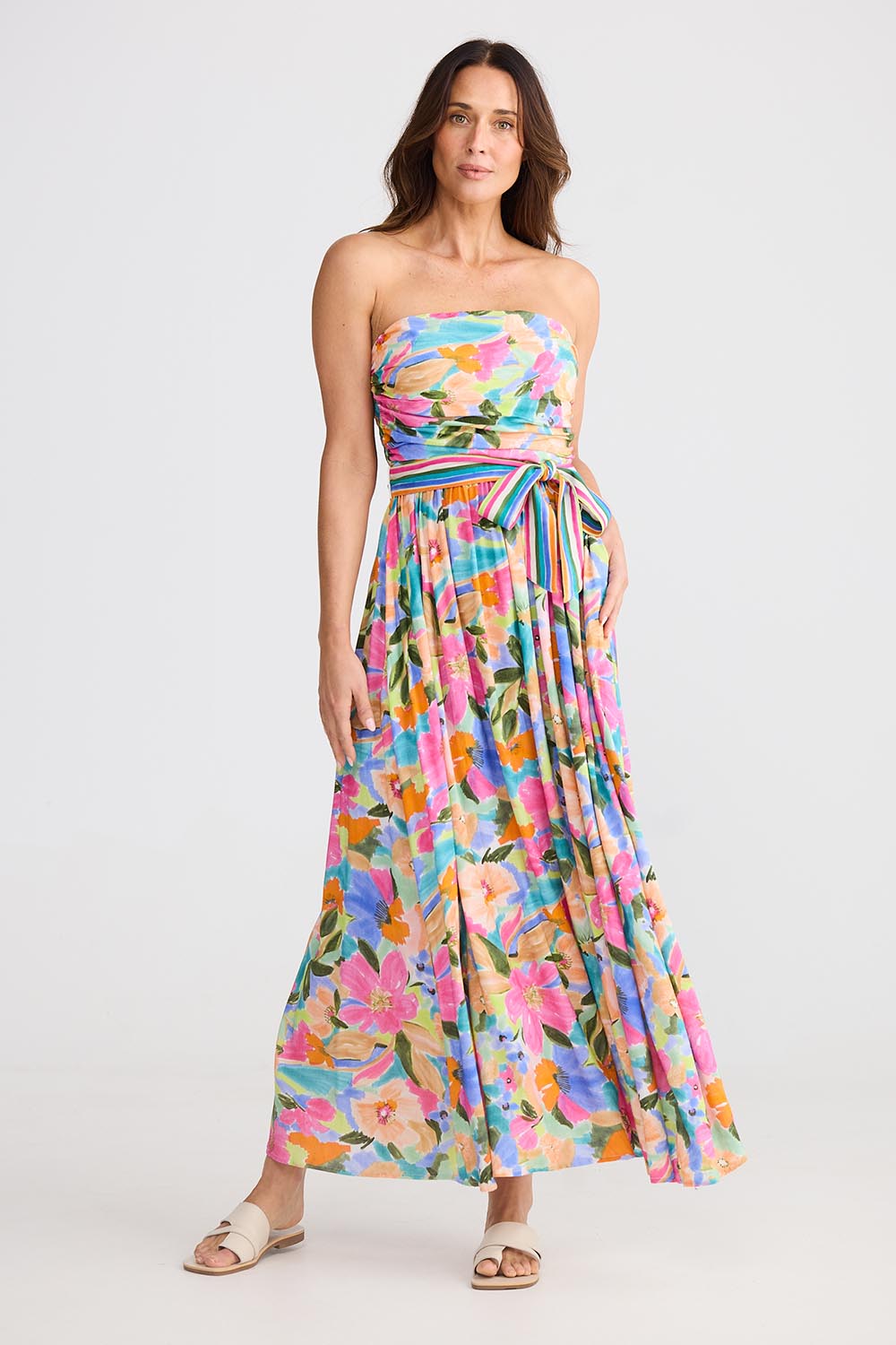 A model wearing the Avalon Dress in colour Electricbl, from the front, showing the whole outfit