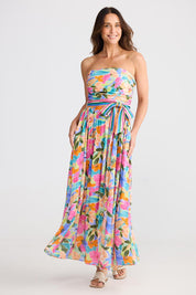 A model wearing the Avalon Dress in colour Electricbl, from the front, showing the whole outfit