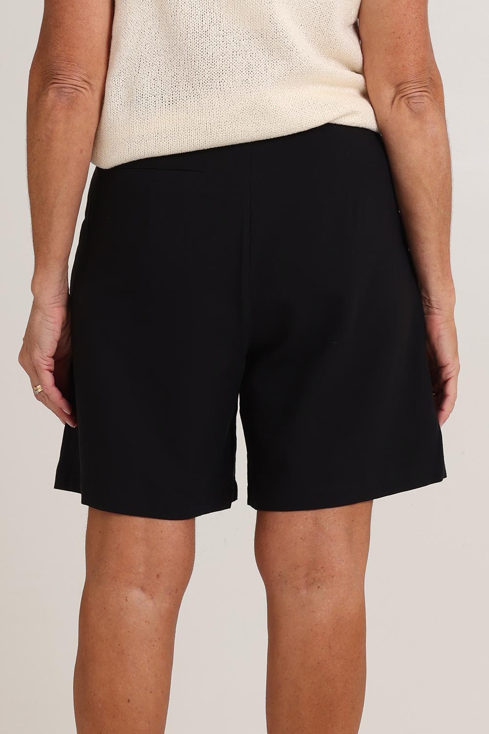 Model Sandy wearing size S of the Eden Cotton Linen Blend Short in colour Black (Black), from the back