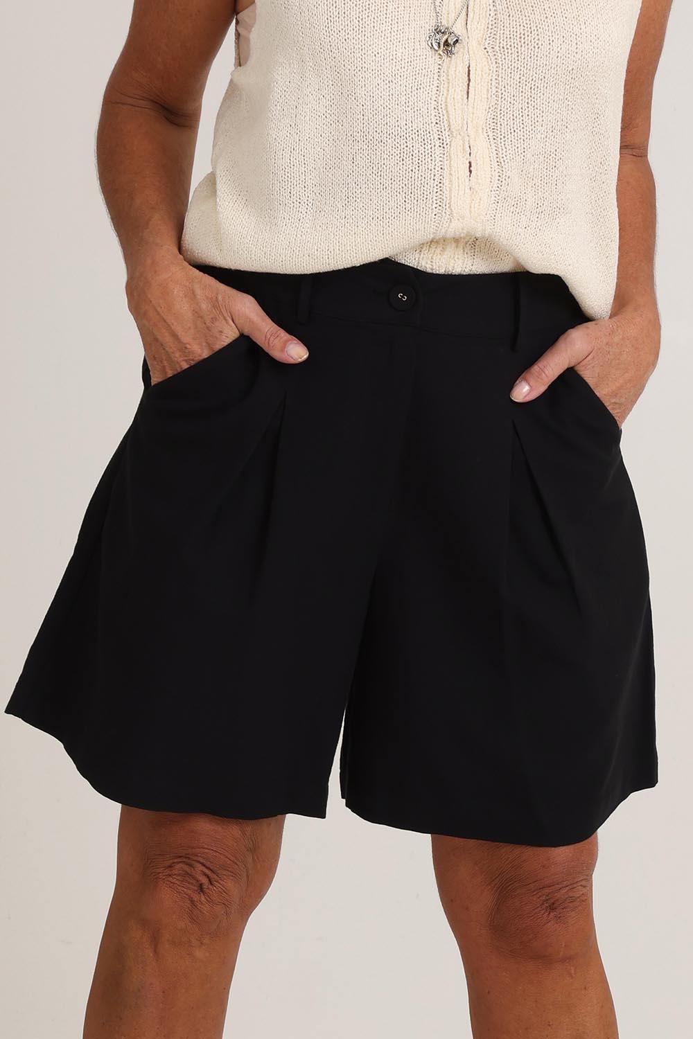 Model Sandy wearing size S of the Eden Cotton Linen Blend Short in colour Black (Black), from the front, cropped image