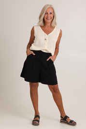 Model Sandy wearing size S of the Eden Cotton Linen Blend Short in colour Black (Black), from the front, showing the whole outfit