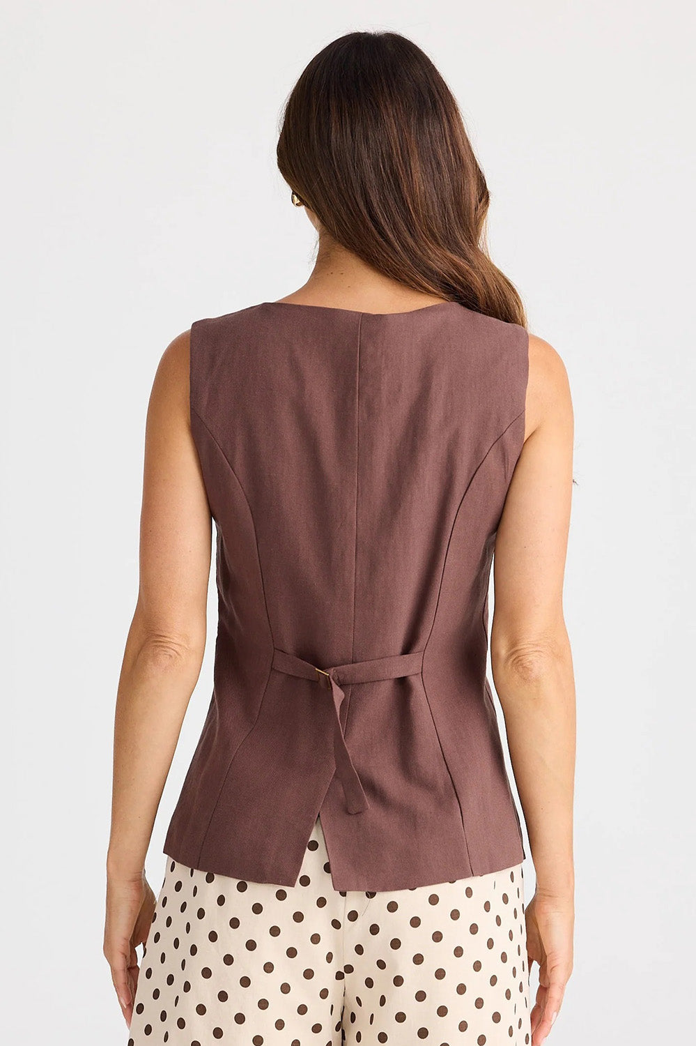 A model wearing the Eden Cotton Linen Blend Wasitcoat in colour Chocolate, from the back