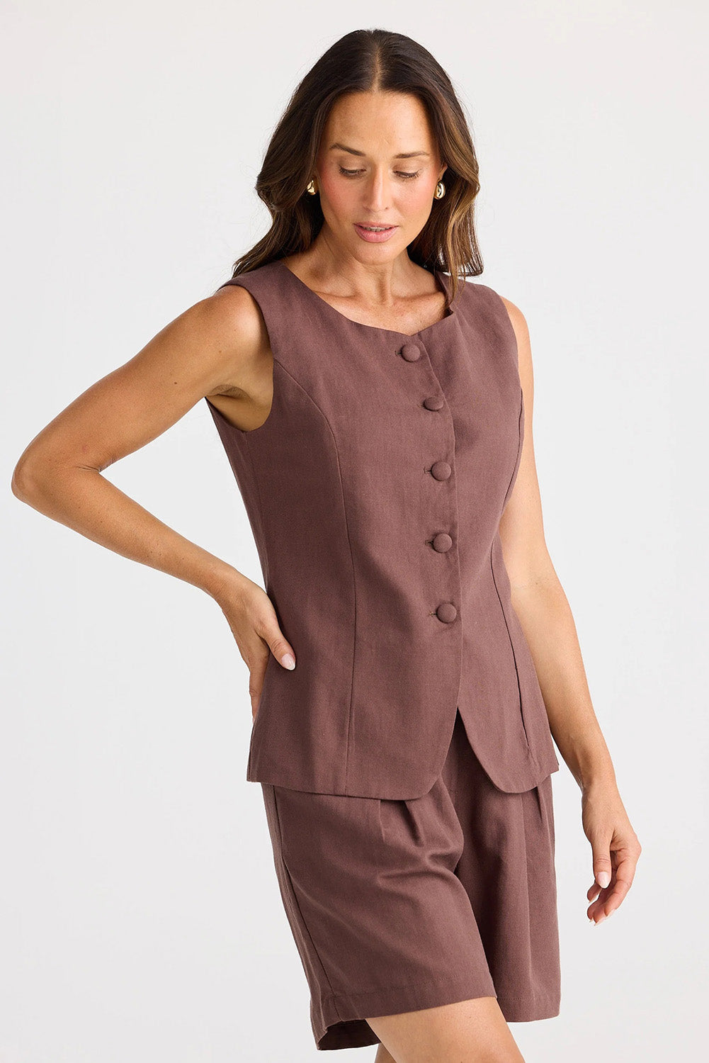 A model wearing the Eden Cotton Linen Blend Wasitcoat in colour Chocolate, from the front, showing the whole outfit