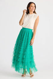 A model wearing the Chance Skirt in colour Jade (Green), from the front, showing the whole outfit