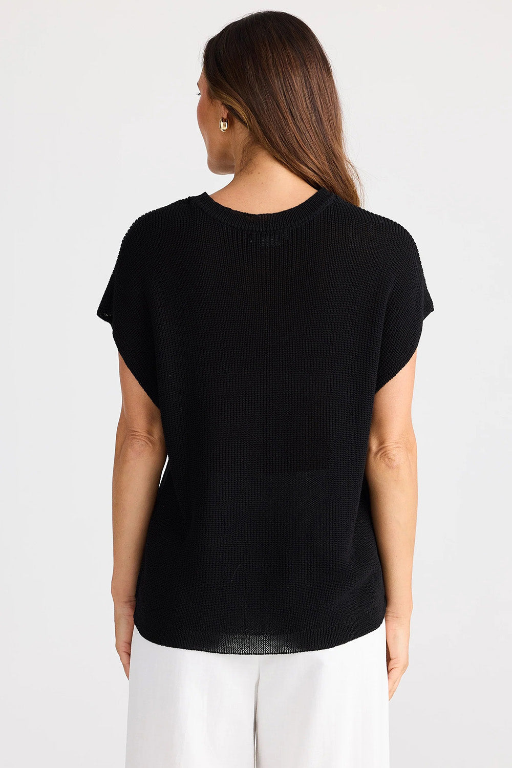 A model wearing the Limo Knit Tee in colour Black (Black), from the back