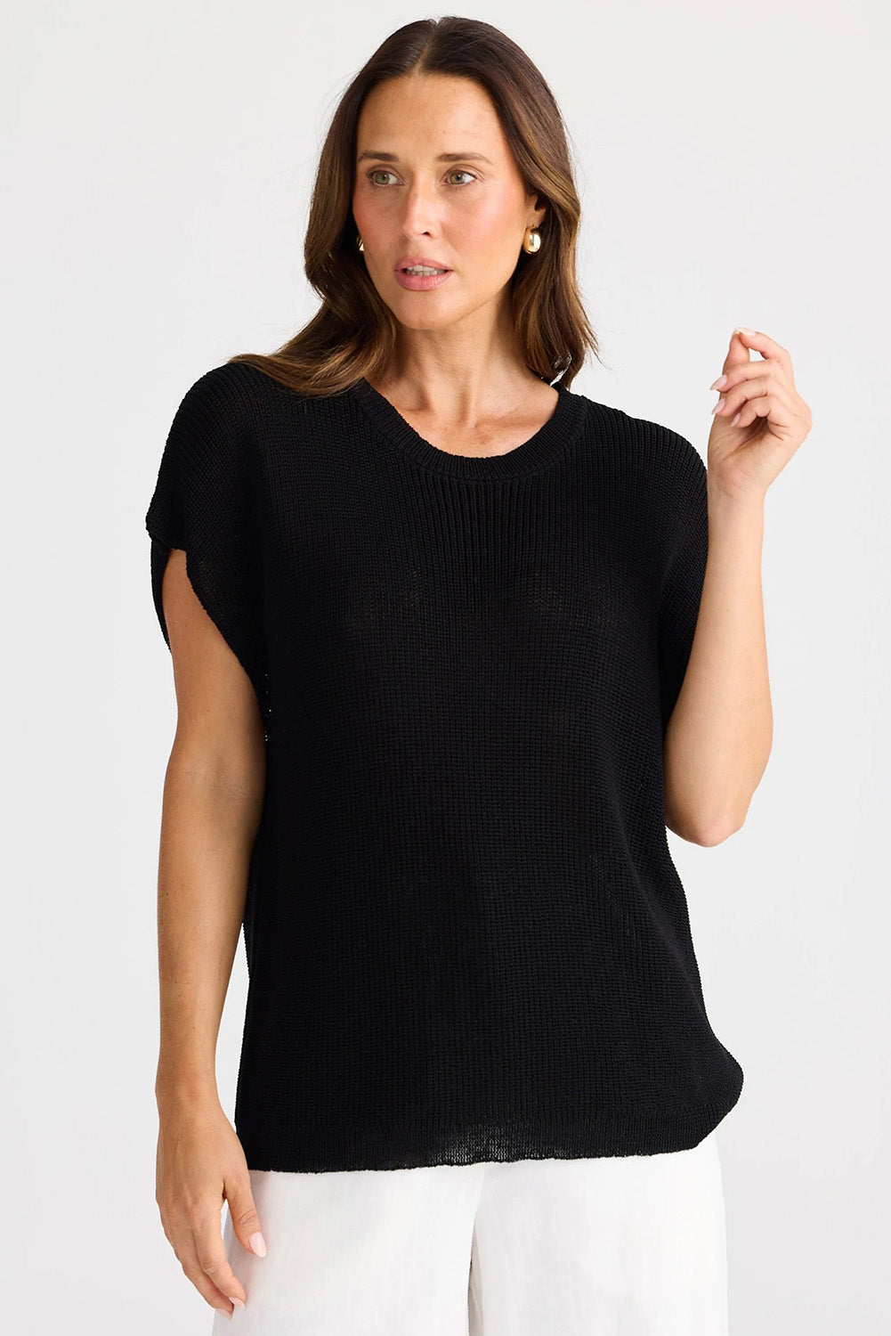 A model wearing the Limo Knit Tee in colour Black (Black), from the front, cropped image