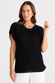 A model wearing the Limo Knit Tee in colour Black (Black), from the front, cropped image