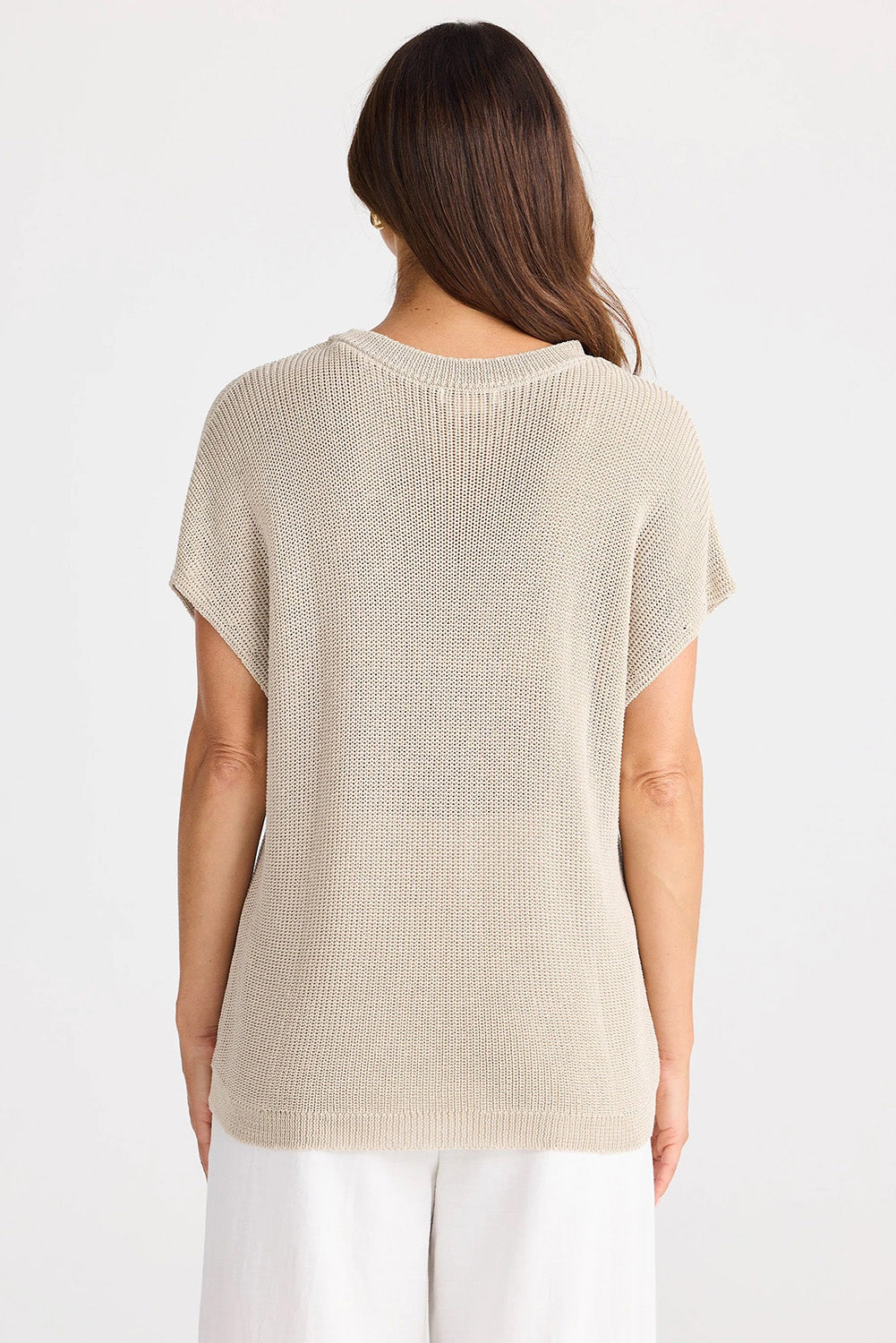 A model wearing the Limo Knit Tee in colour Natural, from the back