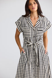 Model Genericm wearing size sample of the Portia Dress – Blkgingham in colour Blkgingham, in a cropped view