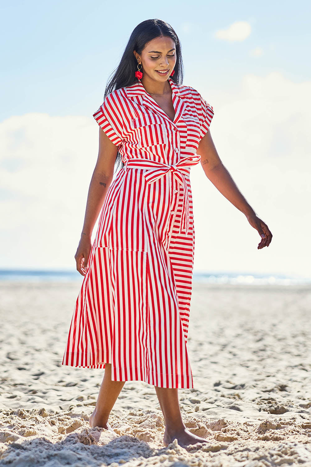 Model Eshan wearing size 10 of the Portia Dress - Cherrystripe in colour Cherrystripe, from the front