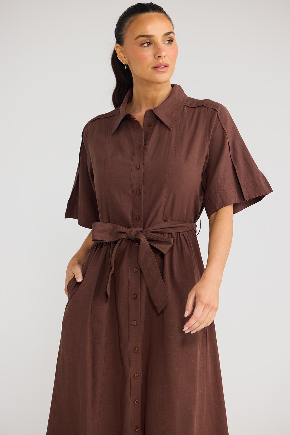 Model Genericm wearing size sample of the Leo Dress - Cocoa in colour Cocoa, in a cropped view
