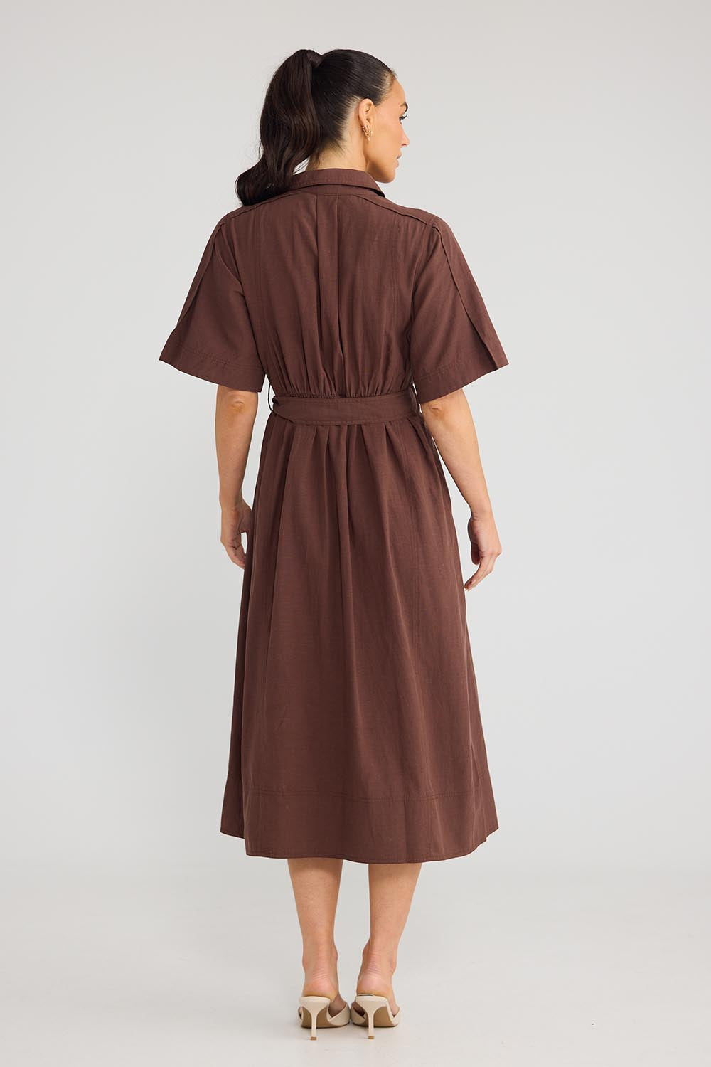 Model Genericm wearing size sample of the Leo Dress - Cocoa in colour Cocoa, from the front